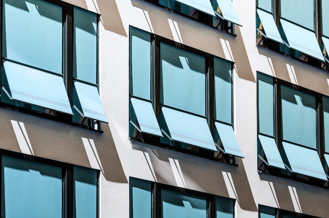 closed  sun blinds on building facade , modern sunshades / awnings